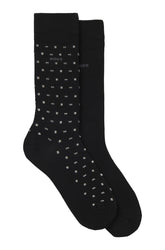Men's black dress socks set with one patterned sock, one solid sock and ribbed cuffs, product view by HUGO BOSS