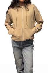 Veste à zip zippé beige fermé, avec capuchon à cordons, poches et logo HUGO pour femme par HUGO BOSS, vue de face