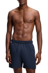 Short maillot marine à taille élastique et petit logo pour homme par HUGO BOSS, vue avant sur mannequin
