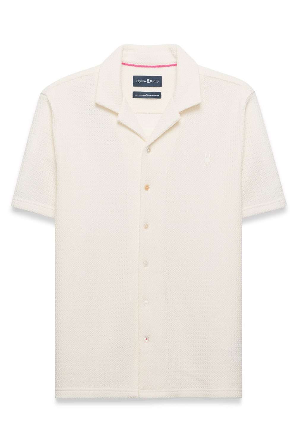 Polo crème texturé à manches courtes, boutons pleine longueur et logo poitrine pour homme par Psycho Bunny, vue avant
