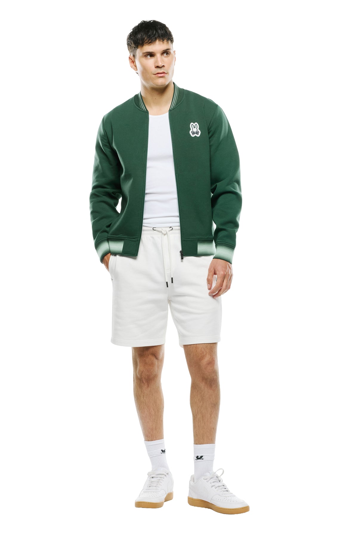 Vue avant complète du jacket bomber verte zippé avec ourlet et poignets rayés vert pâle pour homme par Psycho Bunny