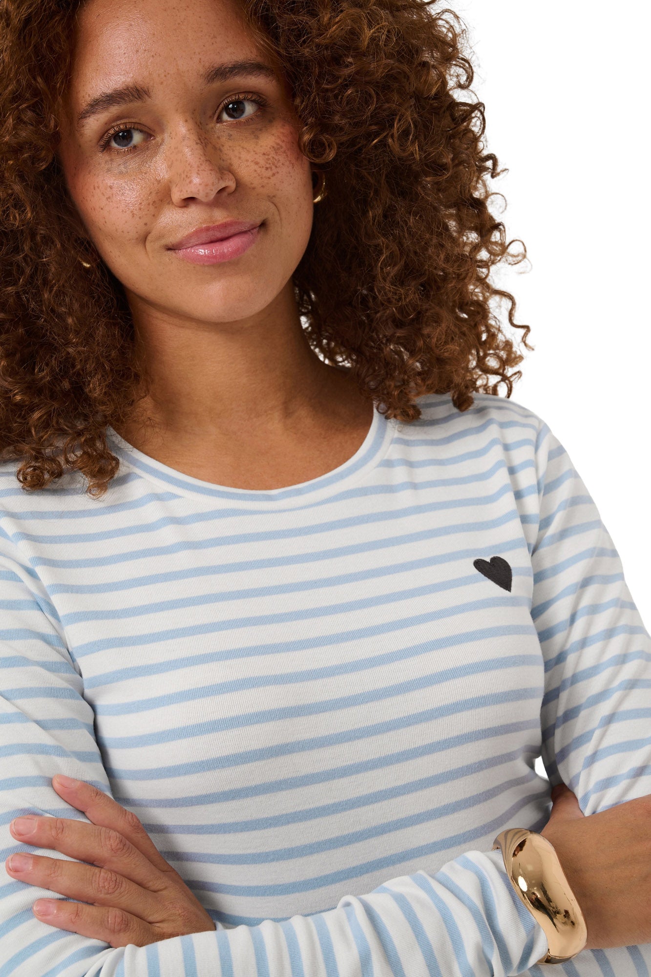 Women's close front detail of striped crewneck Long-sleeve T-Shirt showing black heart patch on chest by Kaffe