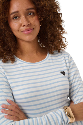 Women's close front detail of striped crewneck Long-sleeve T-Shirt showing black heart patch on chest by Kaffe