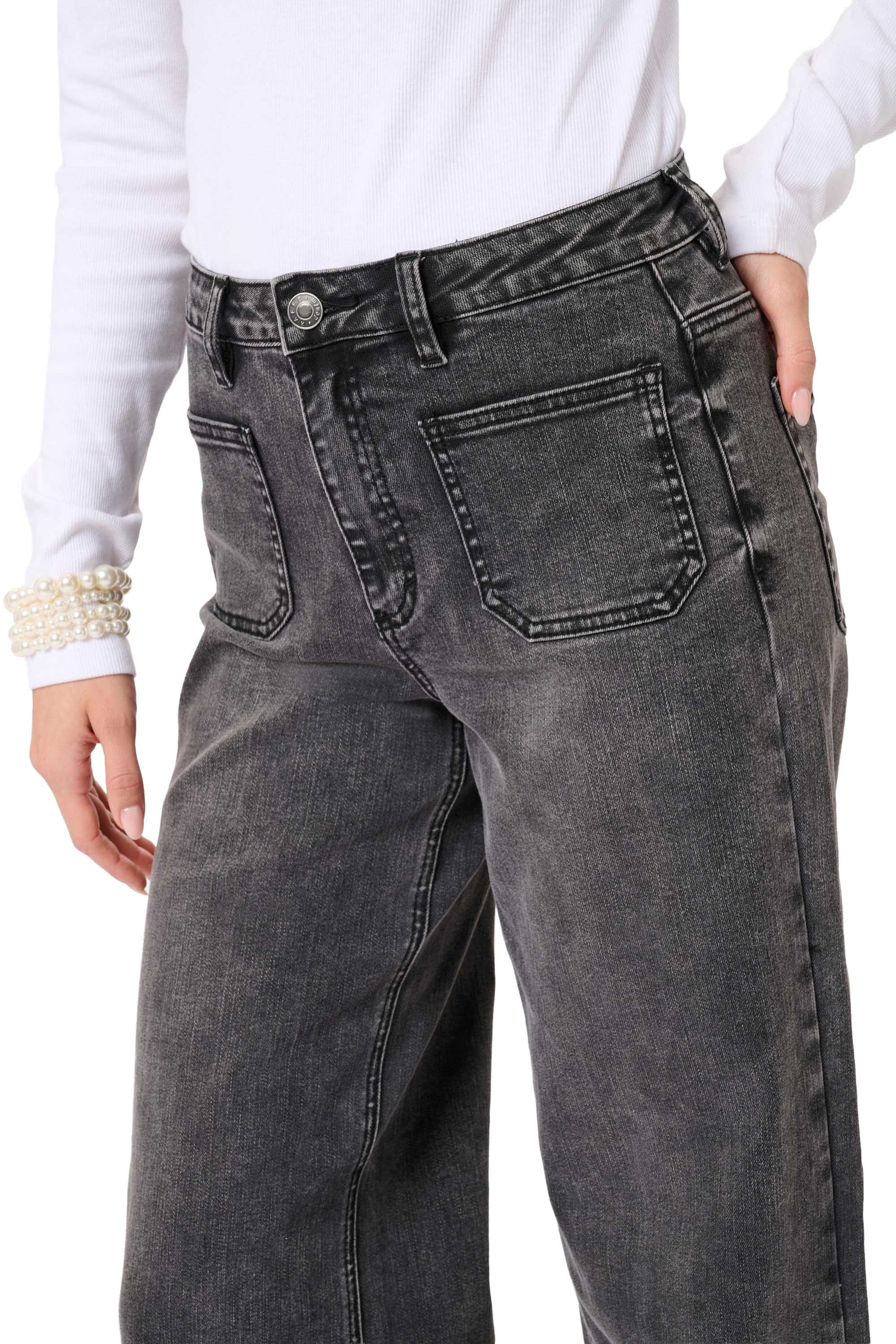 Women's close detail of washed black wide-leg jeans showing button waist, belt loops, and front patch pocket by Kaffe