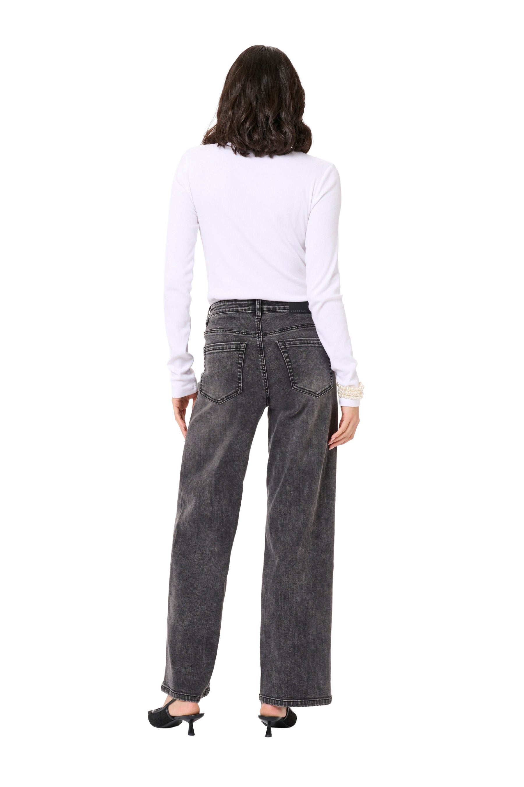 Back model view of women's washed black wide-leg jeans with rear patch pockets and faded seams by Kaffe