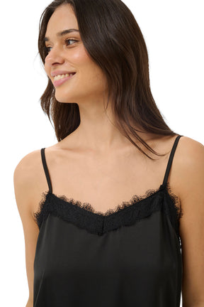 Kaffe women's black camisole sleeveless camisole top with thin straps and lace-trim V neckline on model, close-up