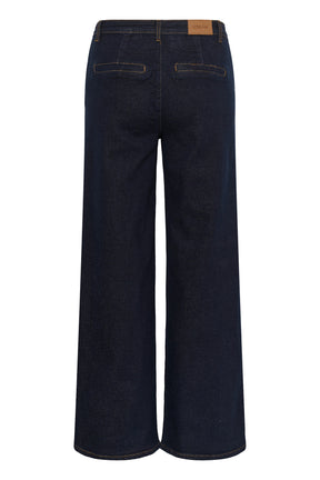 Vue arrière isolée d’une jean à jambe large large indigo foncé avec poches passepoilées et écusson CREAM pour femme