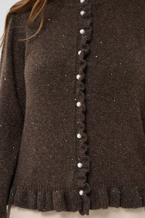 Cream women's dark brown glitter knit cardigan with pearl buttons and ruffled placket, close-up