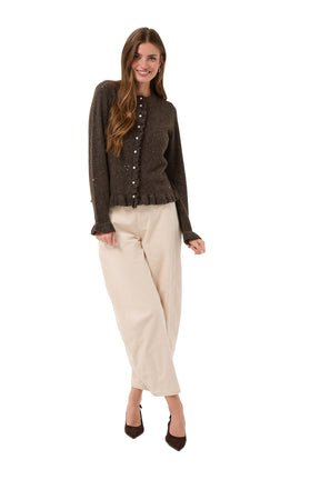 Cream women's full front model view of dark brown glitter cardigan with pearl buttons and ruffle trim