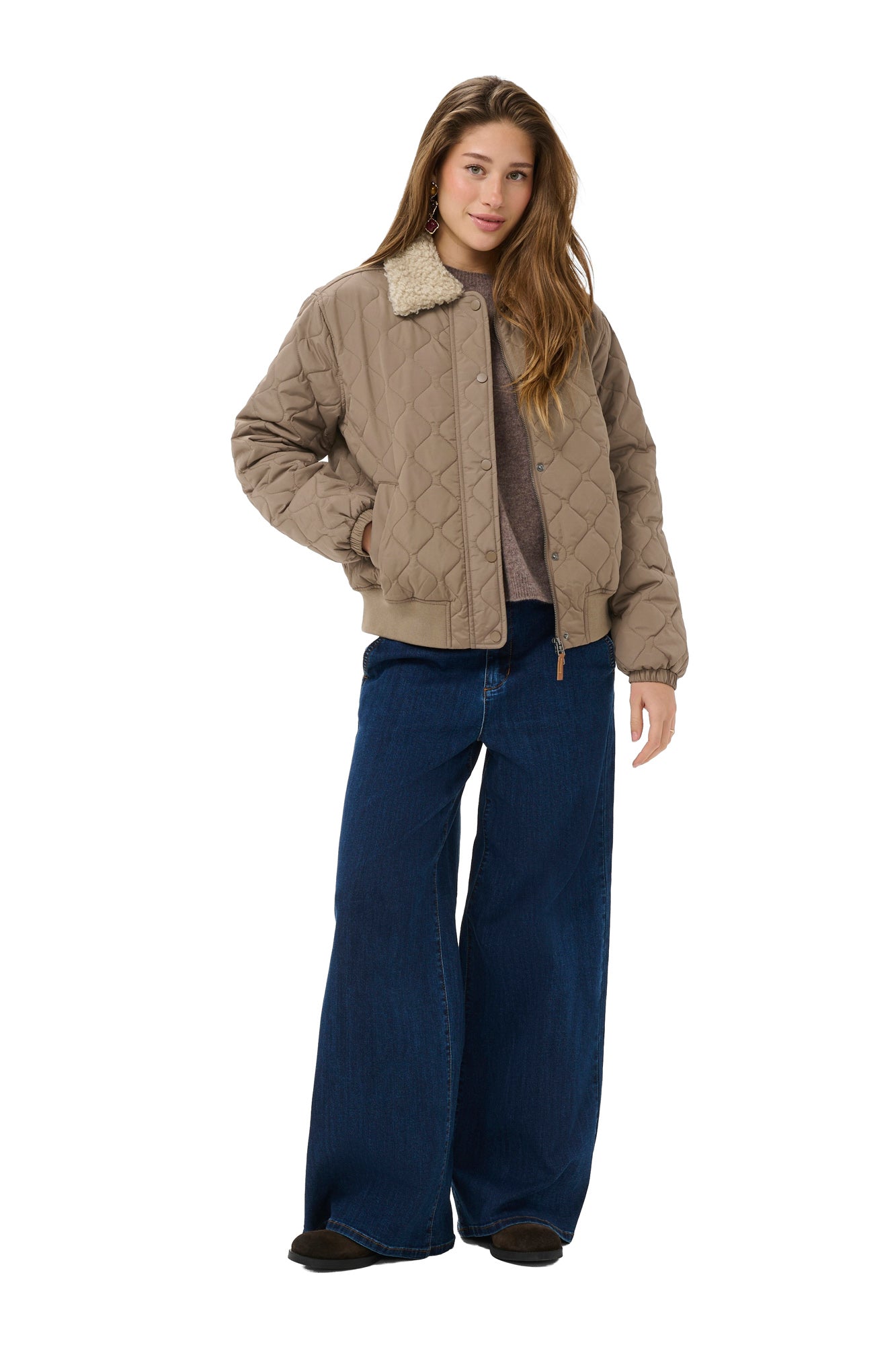 Women's full front view of taupe quilted windbreaker jacket worn open with snap placket and zipper by Cream