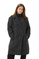 Cream women's black and white herringbone long coat with lapels and double-breasted buttons, front model view