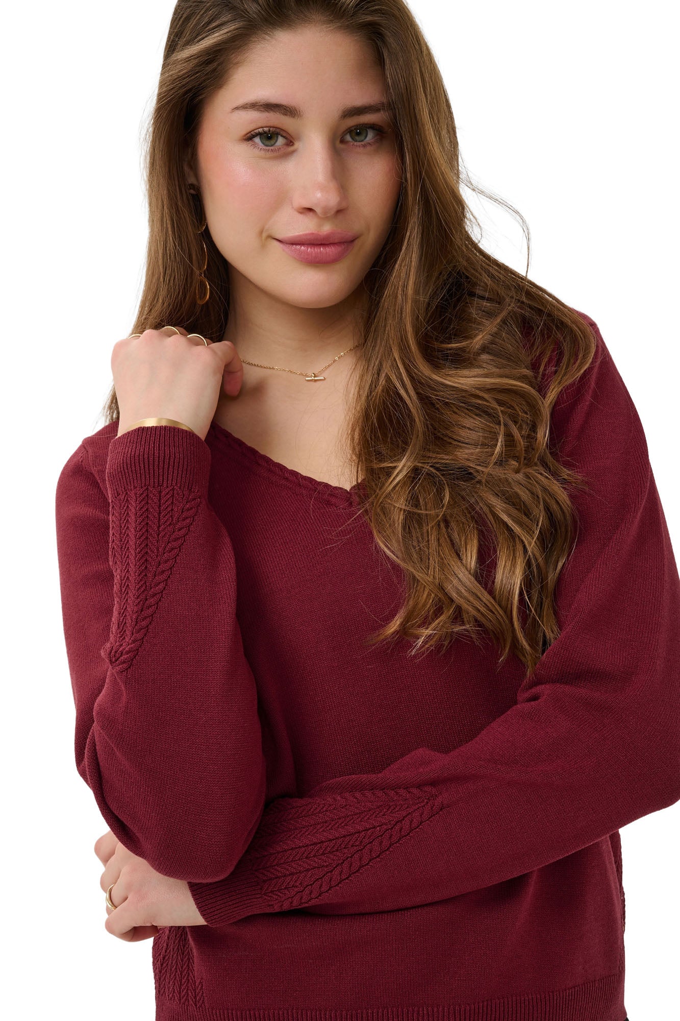 Cream women's burgundy V-neck knit long-sleeve knit sweater showing braided neckline and sleeve texture, close view
