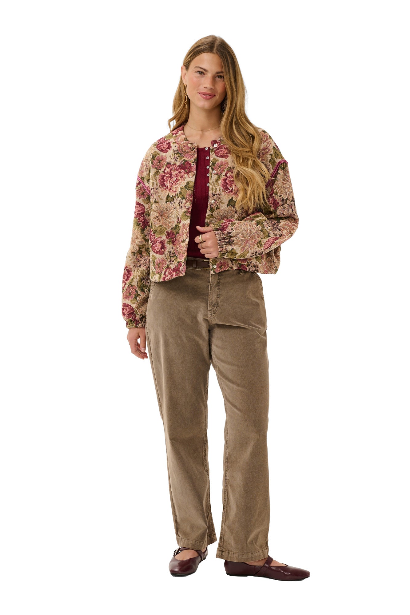 Cream women's full front model view of beige floral cropped jacket worn open over a burgundy top