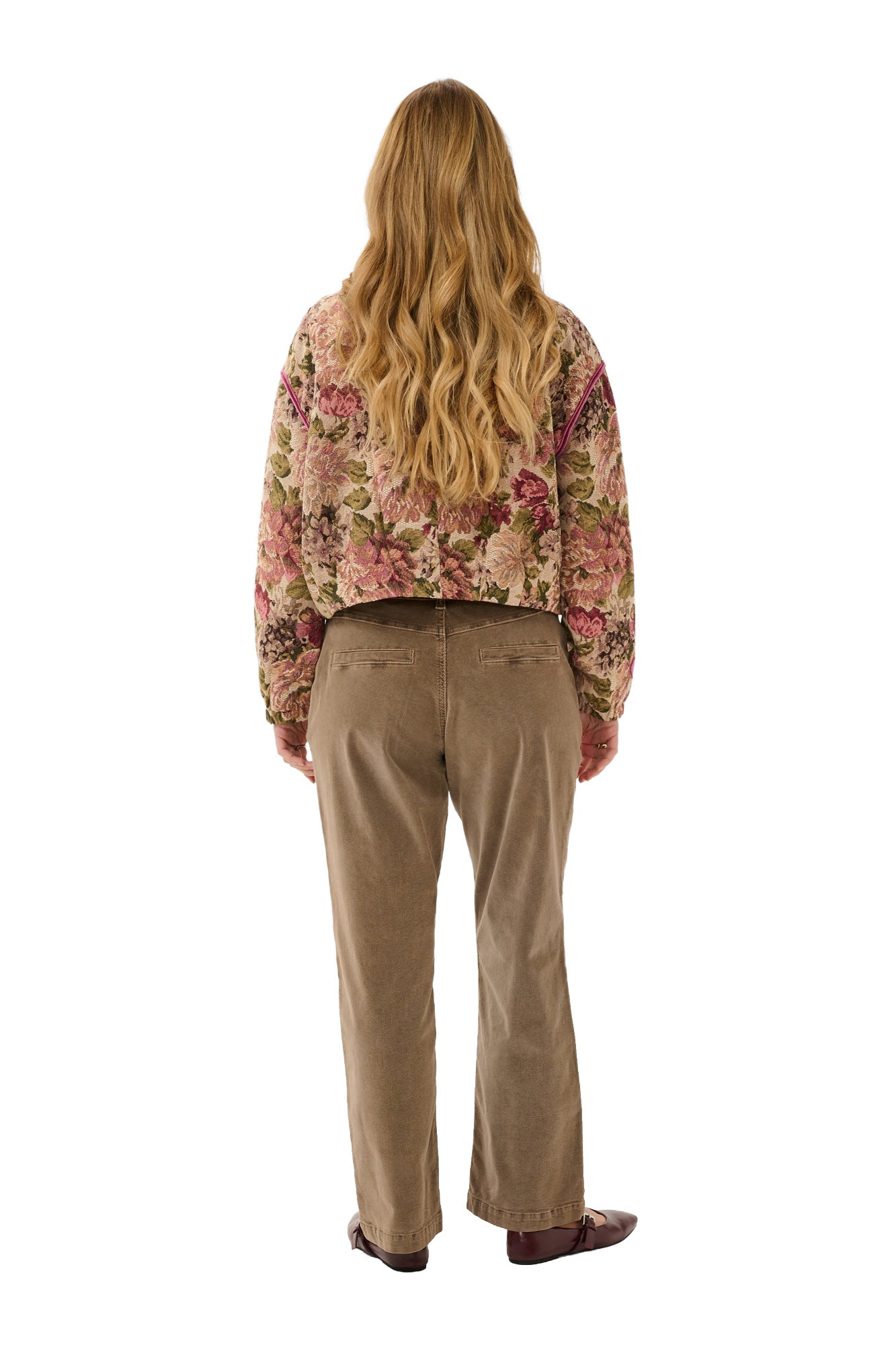Cream women's cropped beige floral tapestry jacket with dropped shoulders and long sleeves shown from the back