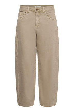 Cream women's beige jeans with button fly, curved leg seams, and tapered hems, isolated front view