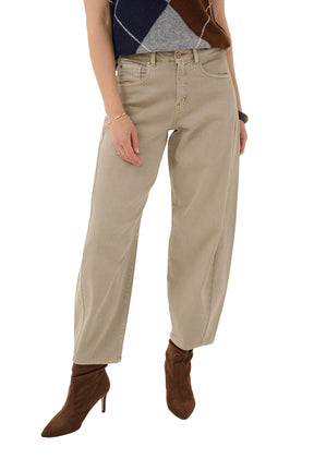 Cream women's beige jeans shown front on model, with wide tapered legs, front pockets, and button fly