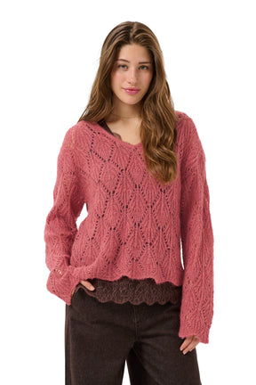 Vue de face du chandail en tricot ajouré rose, col en V, manches longues et ourlet festonné pour femme par Cream