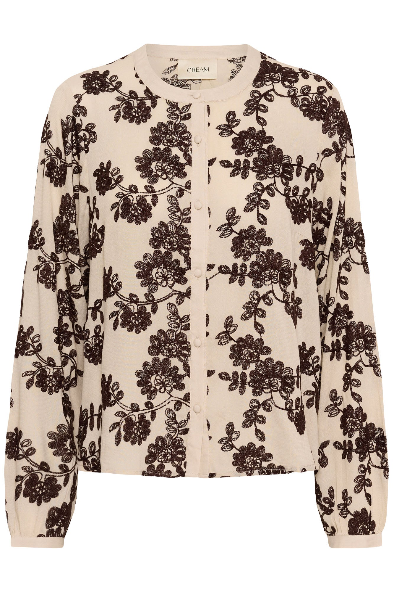 Women's cream button-front long-sleeve blouse with dark brown floral embroidery, isolated front view