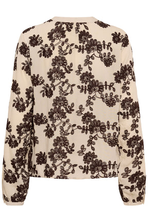 Women's cream button-front long-sleeve blouse with dark brown floral embroidery, isolated front view
