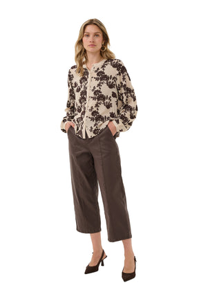 Women's cream button long-sleeve blouse with dark brown floral embroidery and, front model view