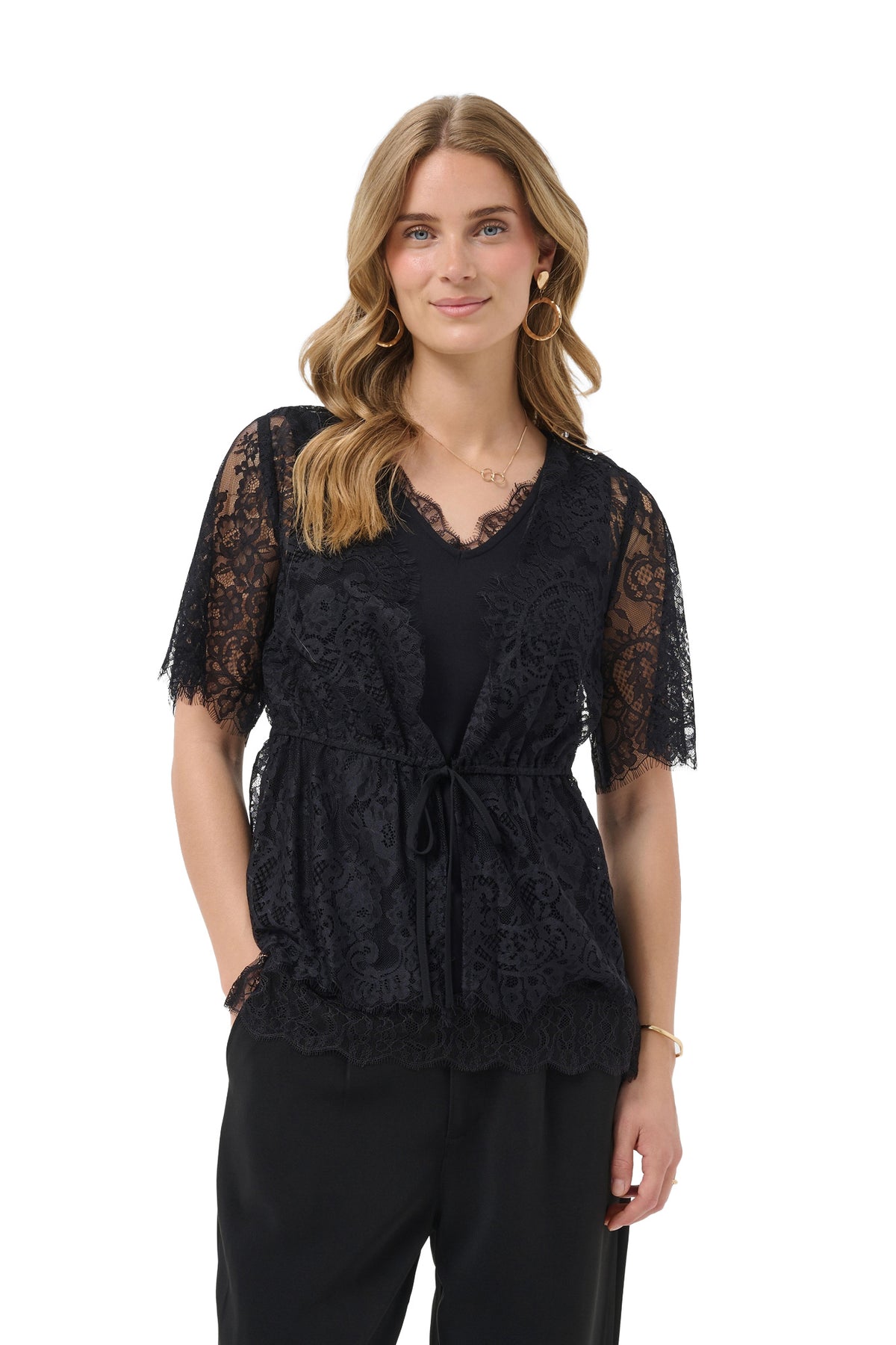 Cream women's black sheer lace short-sleeve blouse front view with, scalloped hem, and waist tie