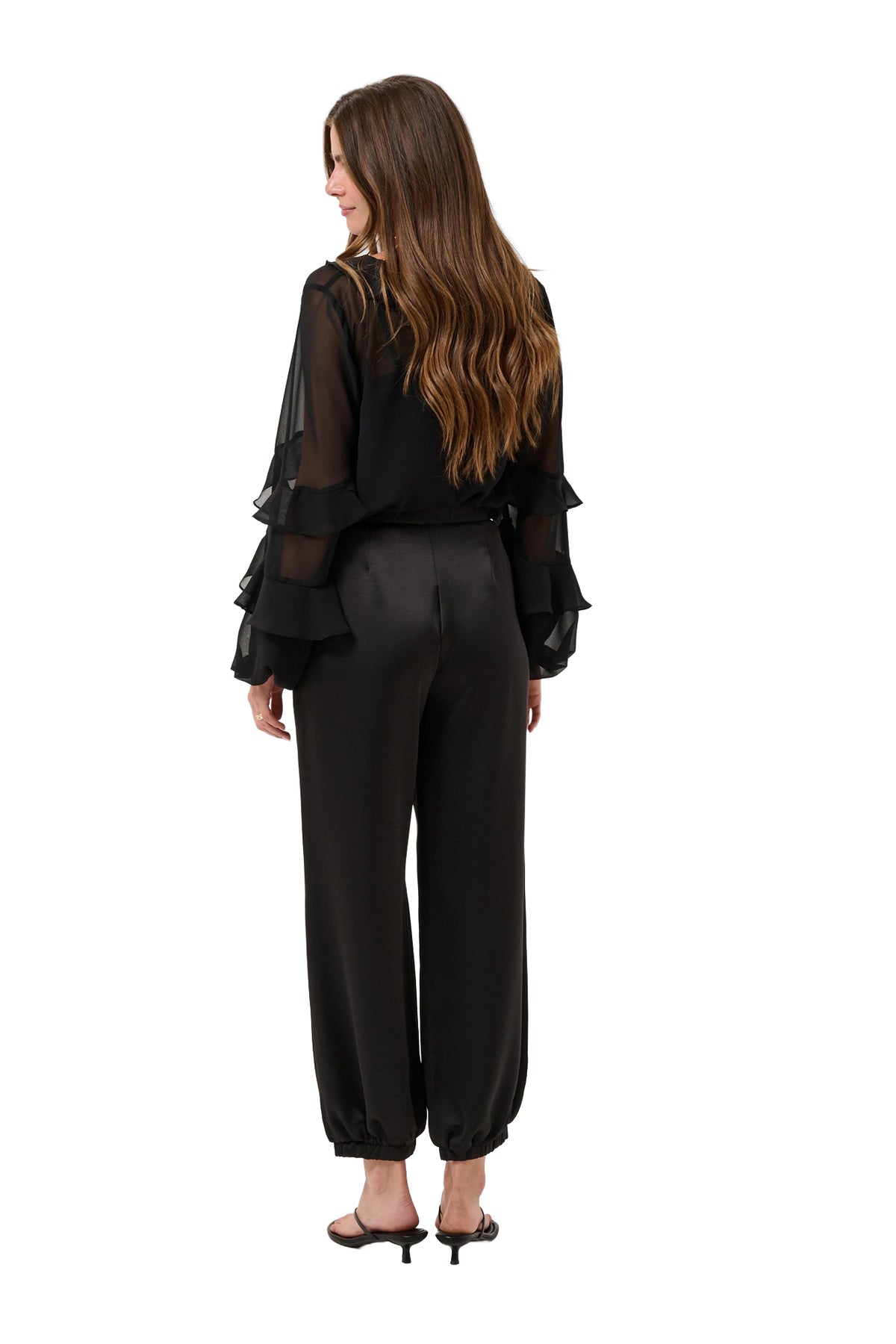 Vue arrière du pantalon jogger noir satiné avec jambe ample et chevilles élastiques pour femme par Cream