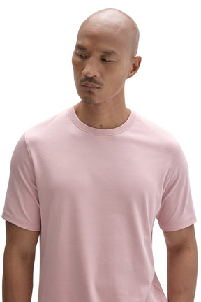 Men's close upper view of light pink crewneck Short-sleeve T-Shirt showing ribbed neckband and by Robert Barakett