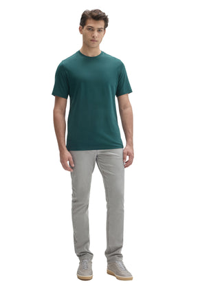Robert Barakett men's full front model view of a teal short sleeve crewneck T-Shirt worn with light gray pants