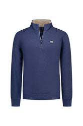 NZA men's blue half-zip sweatshirt front view with stand collar, beige inner collar, and chest logo patch