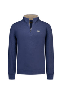 NZA men's blue half-zip sweatshirt front view with stand collar, beige inner collar, and chest logo patch