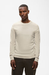 Matinique men's light beige crewneck knit long-sleeve knit sweater with ribbed hem shown from the front