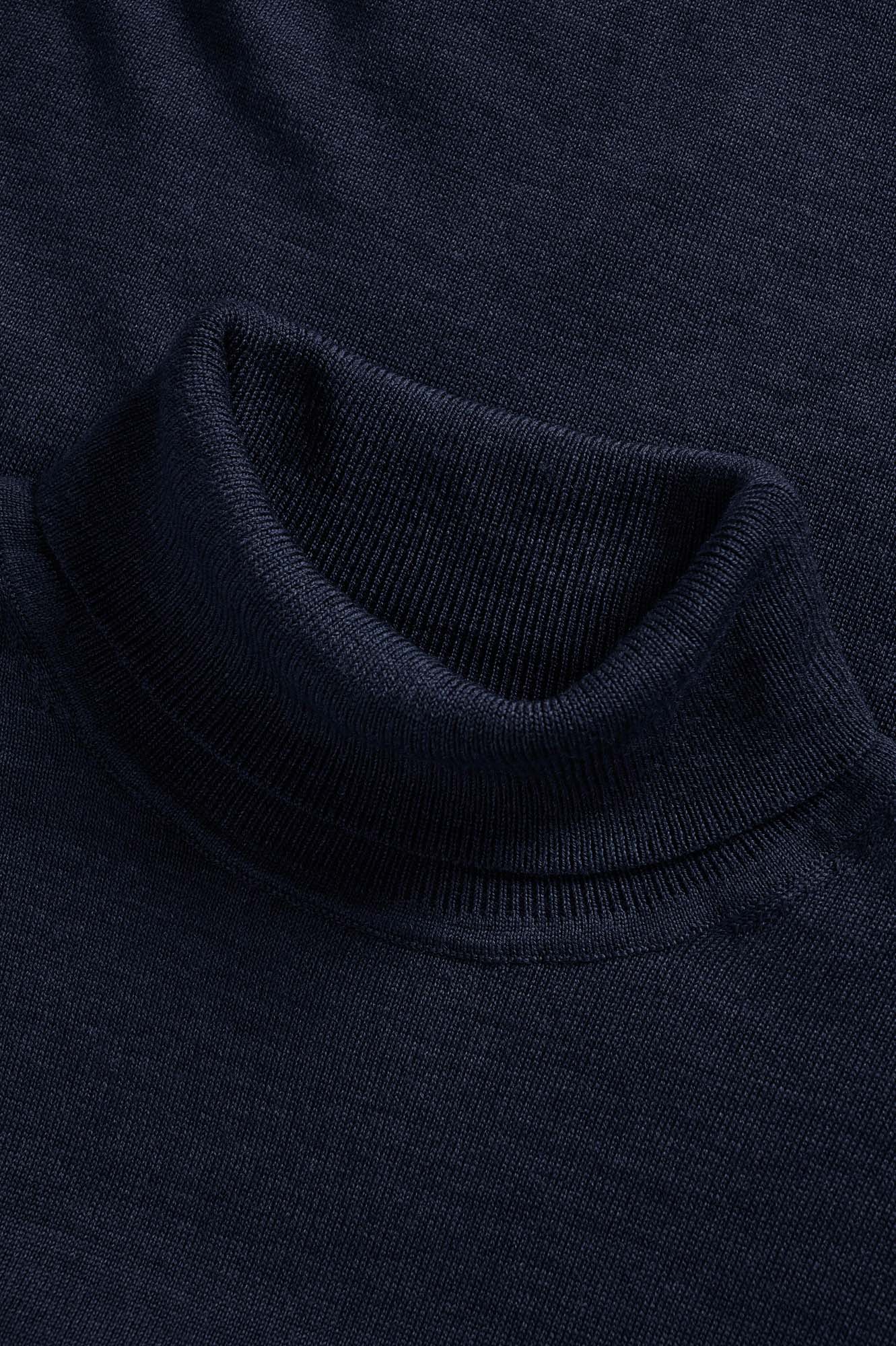 Matinique men's close detail of the navy turtleneck collar, showing long-sleeve knit sweater trim and smooth knit body