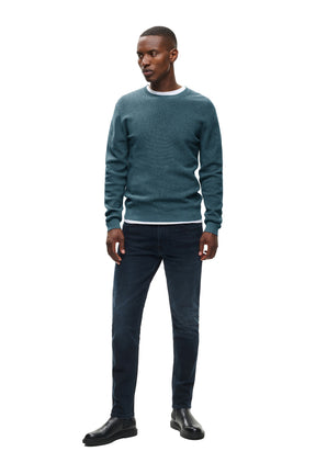 Men's full-length front model view of teal crewneck knit long-sleeve knit sweater with ribbed hem and cuffs by Matinique