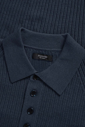 Matinique men's close detail of dark navy ribbed knit long-sleeve polo collar, button placket, and inner neck label