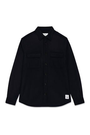 Men's black button-front overshirt with spread collar, chest flap pockets, and small lower patch, product view by Matinique