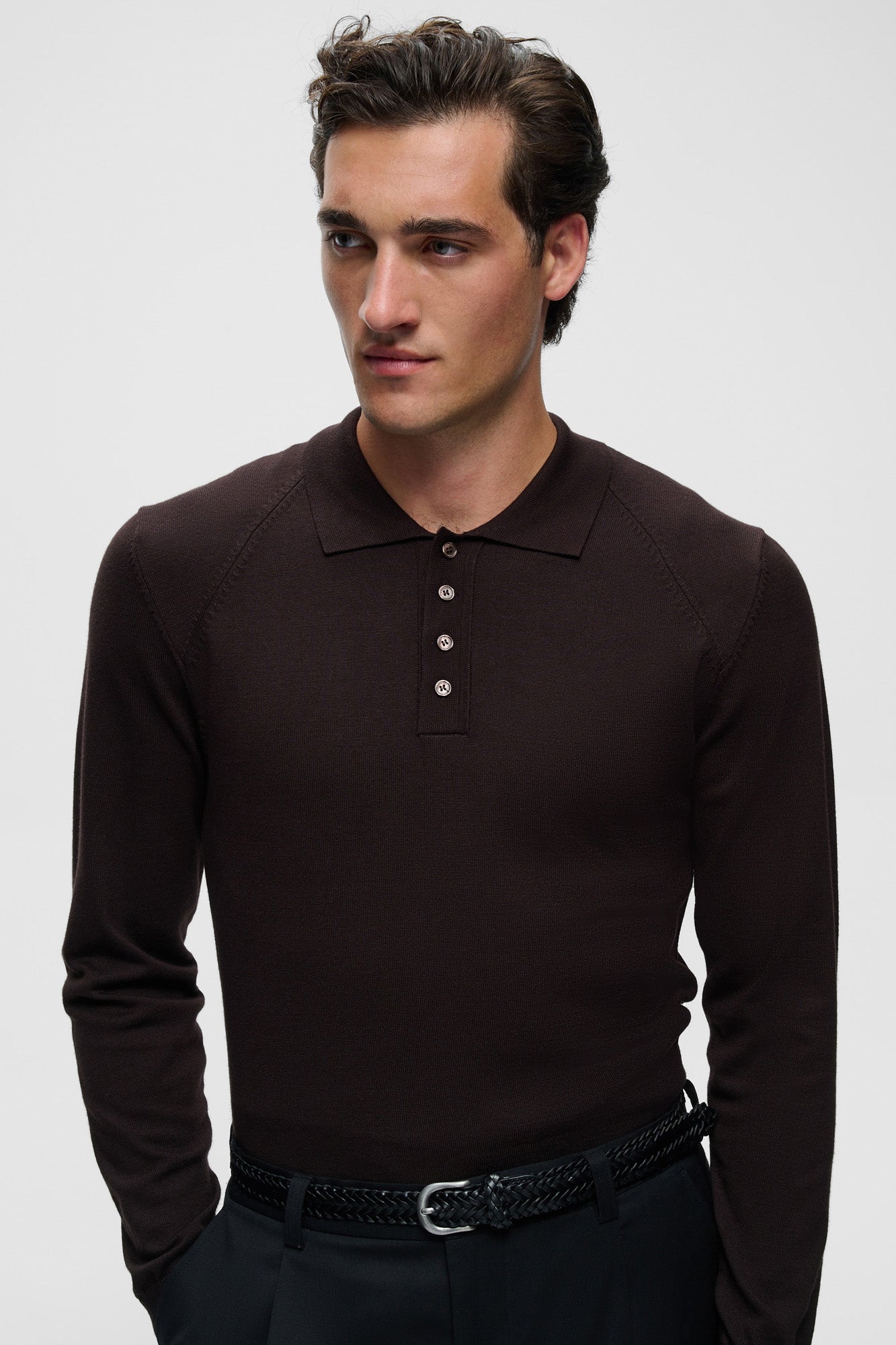 Matinique men's close front view of a dark brown long sleeve polo showing collar, buttons, and shoulder seams