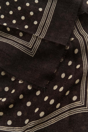 Part Two women's dark brown woven scarf fabric with cream dots, striped border, and frayed edge, close-up