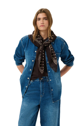 Part Two women's dark brown polka dot scarf tied over a blue denim outfit, front model view
