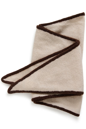 Part Two women's folded cream knit scarf with dark brown edge trim shown flat on a white background