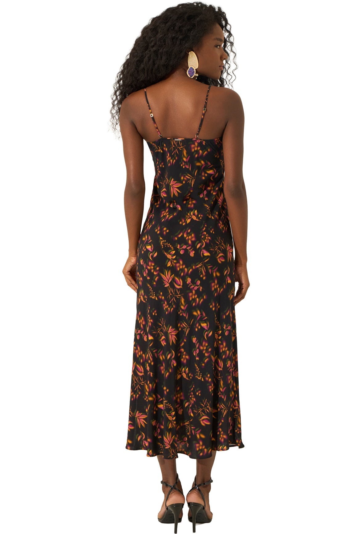 Vue de dos d’une robe midi noire à fines bretelles, imprimé botanique orange et rose pour femme par Lez a Lez