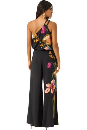 Pantalon jambe large noir avec imprimé floral multicolore sur une jambe pour femme par Lez a Lez, vue de dos