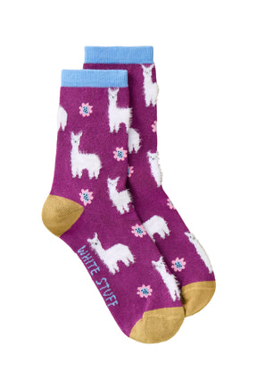 Women's magenta crew socks with fuzzy white llama motifs, pink flowers and blue cuffs, product view by White Stuff