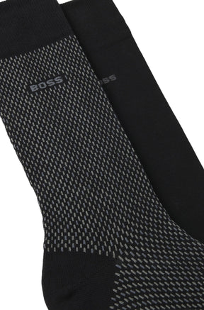 Bas noirs à petits traits gris, bord côtelé et logo BOSS pour homme par HUGO BOSS, en gros plan