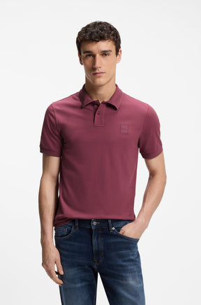 HUGO BOSS men's burgundy short-sleeve polo front view on model with, button placket, and tonal chest patch