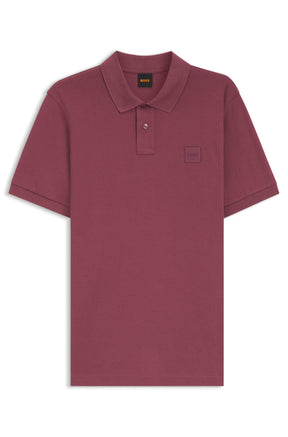 Men's burgundy short-sleeve polo isolated front view with ribbed collar, button placket, and tonal chest patch by HUGO BOSS