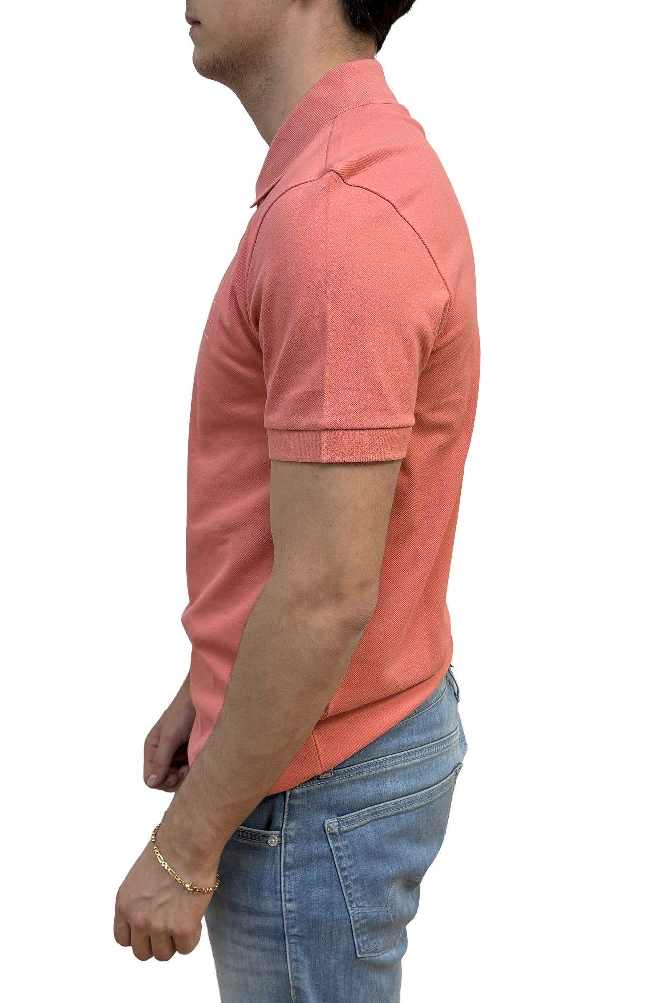 Polo corail à manches courtes avec poignet côtelé, col et couture d’épaule pour homme par HUGO BOSS, vue de côté