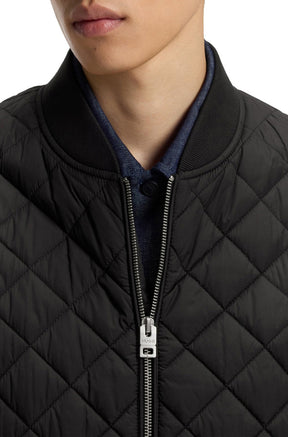 Col côtelé, de la fermeture éclair et matelassage noir de la veste pour homme par HUGO BOSS, en gros plan