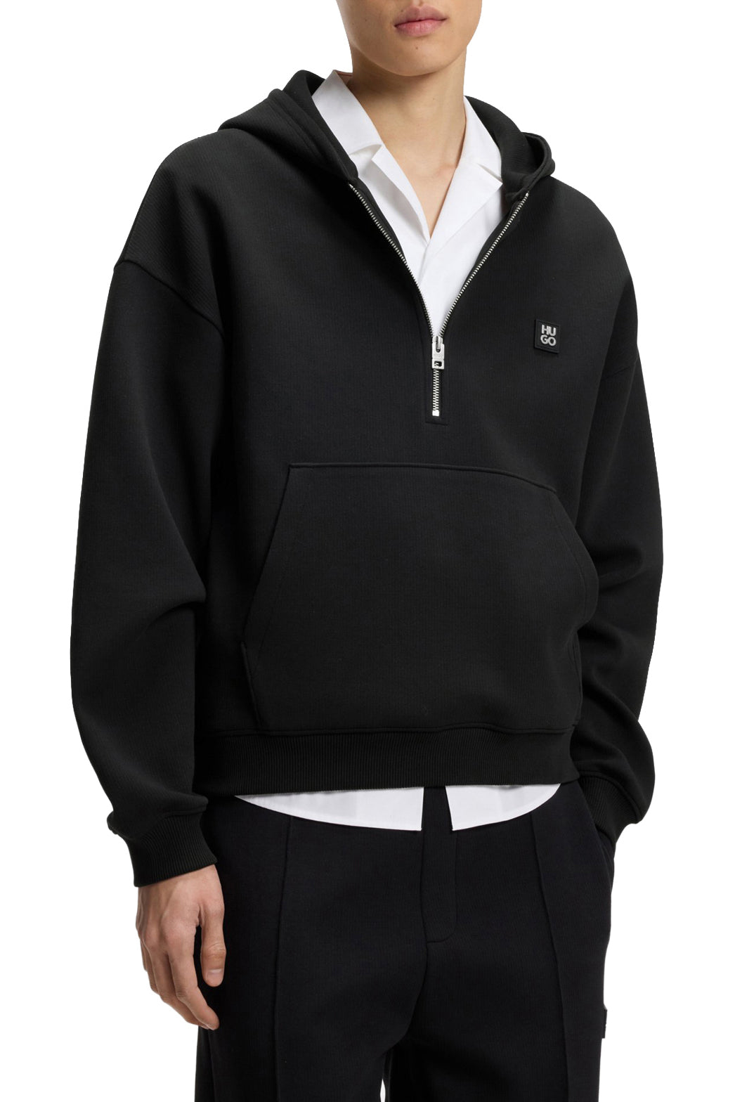 HUGO BOSS men's black half-zip sweatshirt on model with kangaroo pocket, ribbed cuffs and chest logo shown from the front