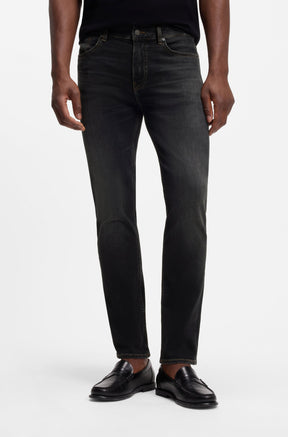 HUGO BOSS men's black washed straight-leg jeans with five-pocket styling, front model view