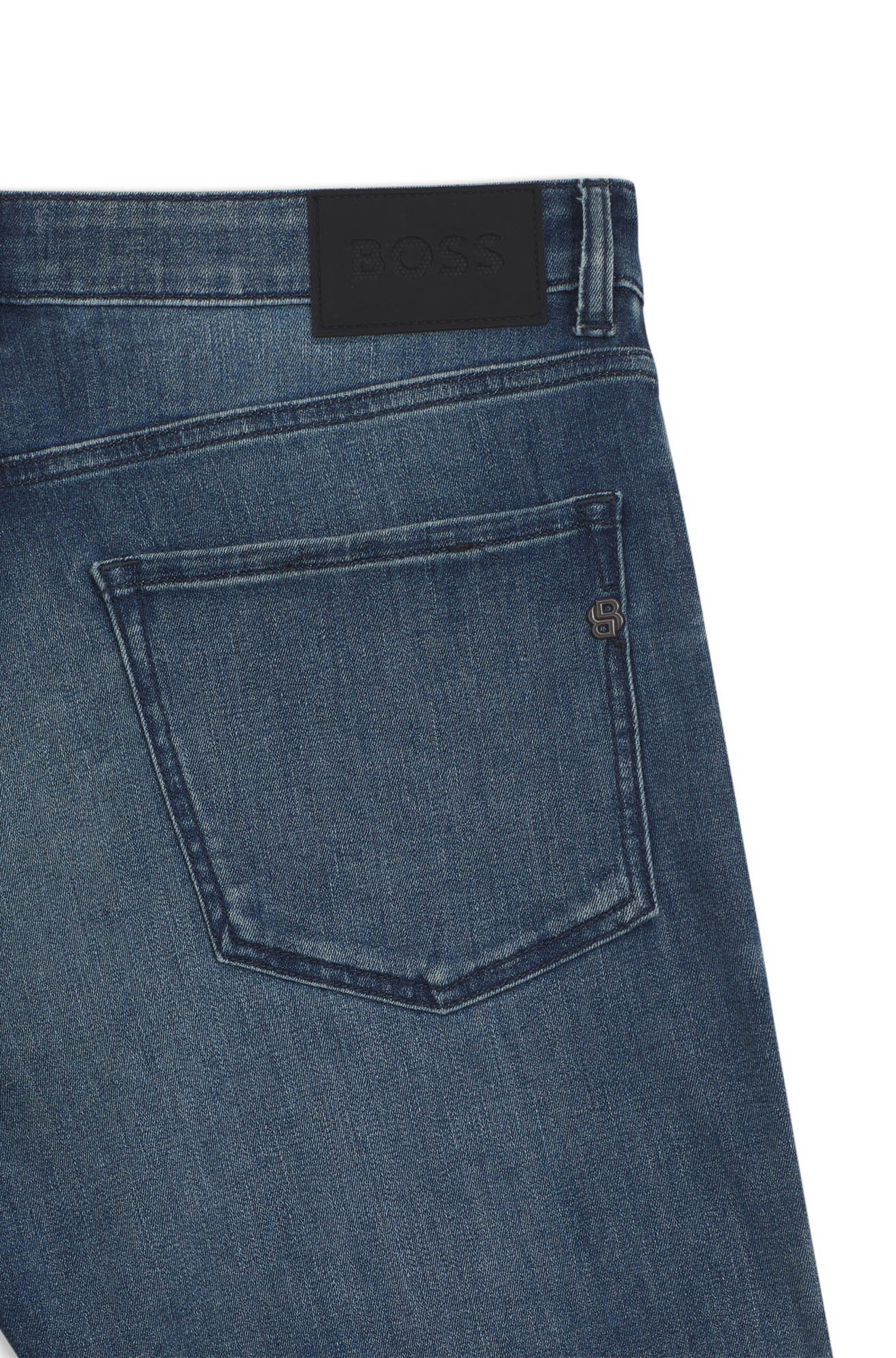 HUGO BOSS men's back pocket detail of blue washed straight-leg jeans with black BOSS waist patch and small metal B logo